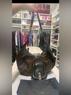 Fendi Tobacco Zucca canvas "B Buckle" hobo bag featuring brown leather i. EUC